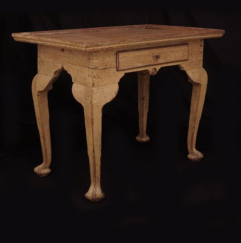 A light brown Rococo table. Denmark circa 1760. H: 
77cm. Top: 90x61cm