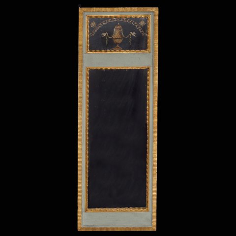 A partly gilt Louis XVI-mirror. Circa 1790. Size: 
126x42cm