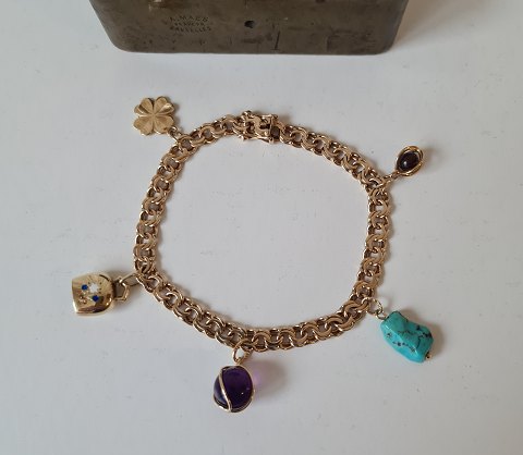Vintage Bismarck bracelet with 5 charms in 14 kt gold