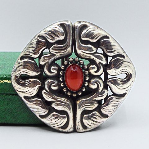 Bernhard Hertz; An Art Nouveau silver belt buckle with set with a carnelian