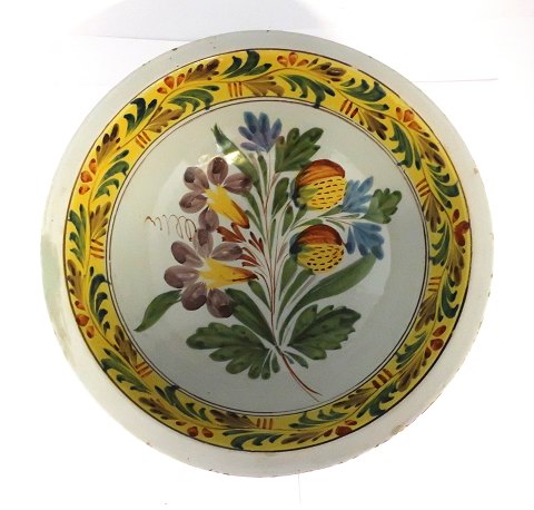 Kellinghusen. Earthenware dish. Diameter 28 cm. Height 10 cm. With very small 
edge notches and old repair. (see photo)