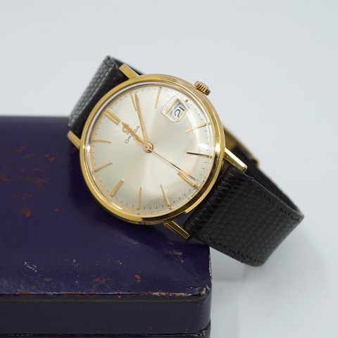 Omega; Armbåndsur i stål med guld 1965