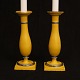 A pair of yellow painted candle sticks. Denmark circa 1840. H: 21,6cm