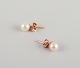Swedish goldsmith. A pair of classic ear studs in 18 karat gold adorned with cultured pearls.