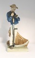 Royal Copenhagen. Harvesting Worker with a scythe. Model no. 685. Height 25 cm. 
(1 quality)