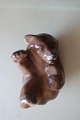 Royal Copenhagen (RC) Figurine
Bear cub, lieing/sleeping made of porcelain
Design: Knud Kyhn, Denmark
No.: 1124
1. Grade
L: 8cm 
In a very good condition