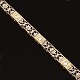 14kt hvidguld leddelt armlænke prydet med gennembrudte dekorationer og tre 
diamanter ca. 0,25ct i alt. L: 18,5cm. B: 4,5mm