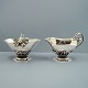 Georg Jensen; A set with sugar bowl and creamer of sterling silver, No 235 A
