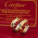 Cartier; Par medium Trinity øreringe af 18 kt. guld