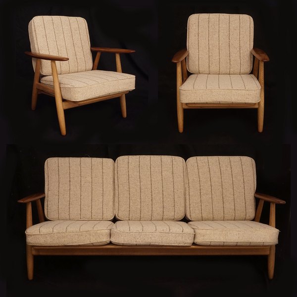 Hans J. Wegner, 1914-2007: "The Cigar". Set of two armchairs and a sofa. Oak and 
Teak. GE 240. Designed by Wegner circa 1955