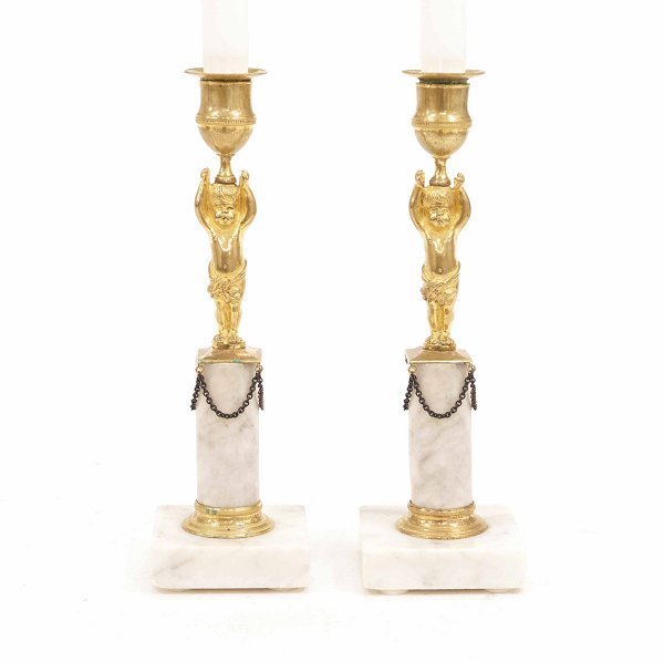 A pair og gilt early 19th century bronce candlesticks. France circa 1810. H: 
25cm