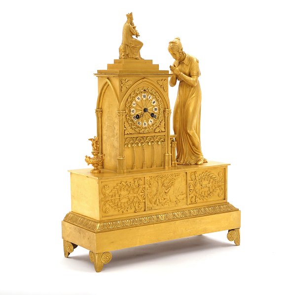 A gilt Empire mantel bronze clock. France circa 1820. H: 49cm. W: 36cm