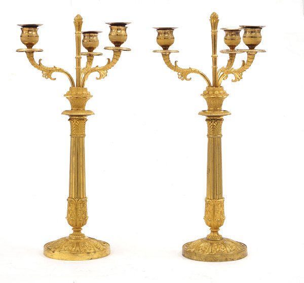 A pair of gilt early 19th century bronze candelabra. France circa 1820. H: 44cm