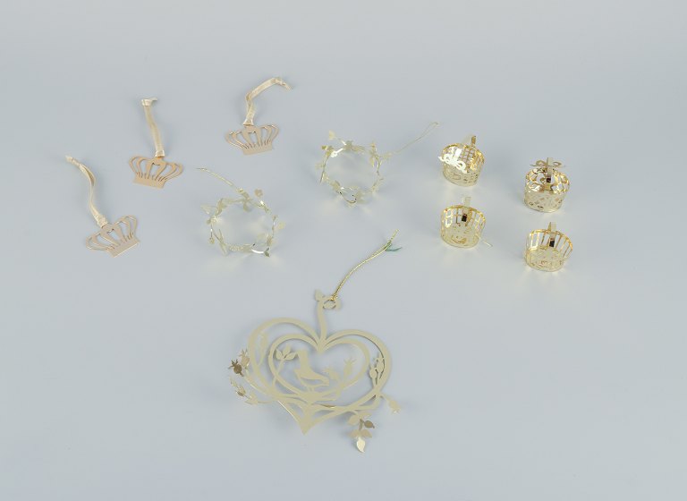 Royal Copenhagen "Royal Christmas". Set of ten brass Christmas ornaments for hanging on the Christmas tree and in the window.