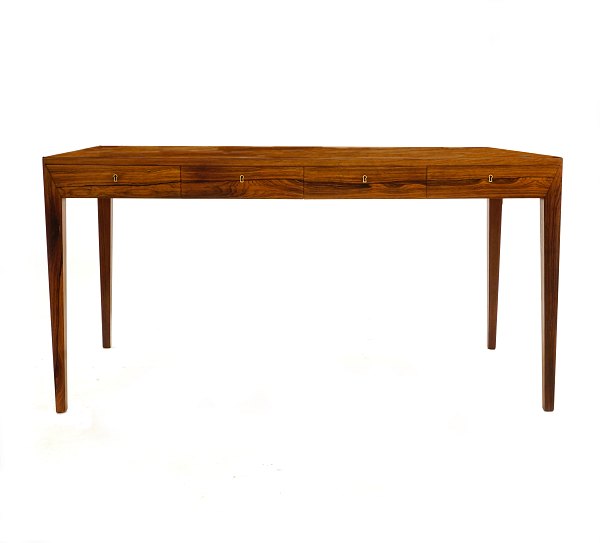 Rosewood veneered writing table by Severin Hansen, Denmark. Manufactured by 
Haslev Møbelsnedkeri. Nice condition. H: 73cm. Plate: 75x143cm