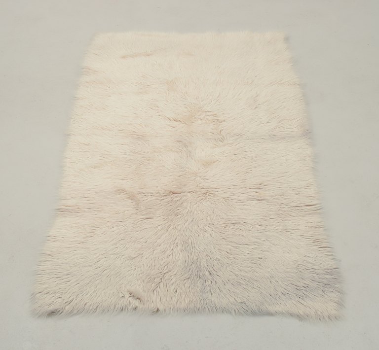 Scandinavian textile designer.Rya carpet in pure wool.