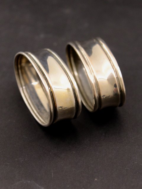 A pair of almost identical napkin rings