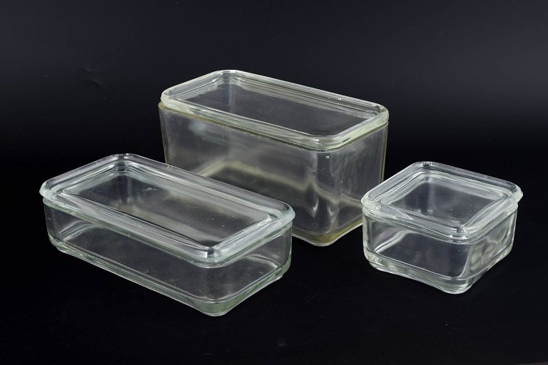 Set of three Wilhelm Wagenfeld “Kubus” glass boxes.